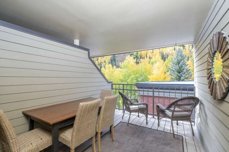 Partially covered deck off of the Primary Bedroom is perfect for evening meals, morning coffee or happy hour sunset.