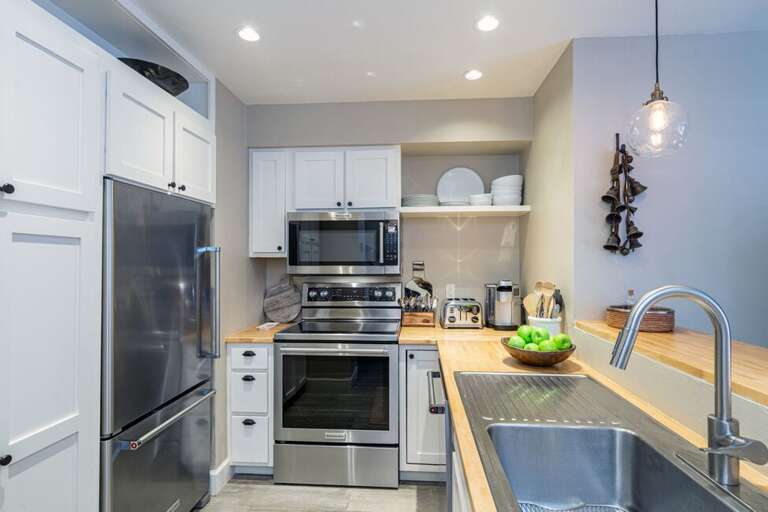 The fully equipped kitchen is perfect for cooking and gathering.