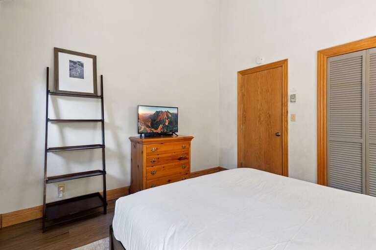 The guest bedroom offers plenty of storage space.