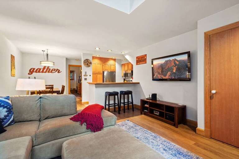 Open concept living/dining and kitchen with cozy seating and perfect for  chillen after a fun day.