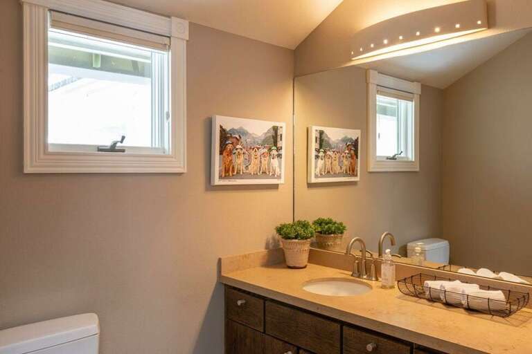 There is a half bathroom on the second level just off the living room.
