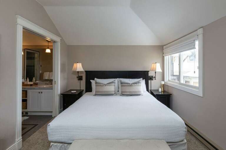 The primary bedroom is on the second level just off the living and kitchen areas.