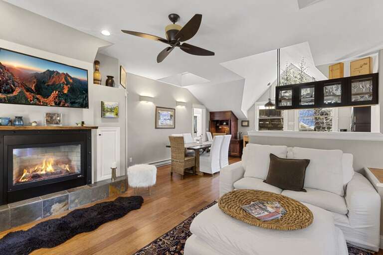 Warm and inviting living space with a cozy fireplace and comfortable seating for relaxing after mountain adventures.