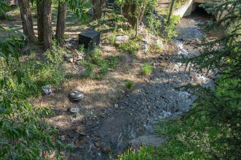 Enjoy the views and sounds from Cornet Creek which flows right below the porch.