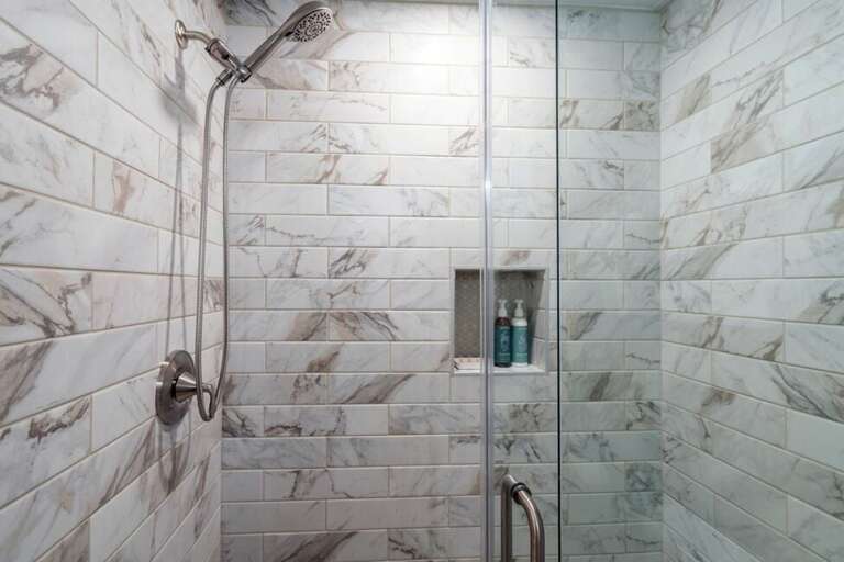 Soothing marble tile and Puracy body/hair products make for a spa experience.