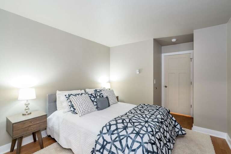 The second guest bedroom has a queen bed.