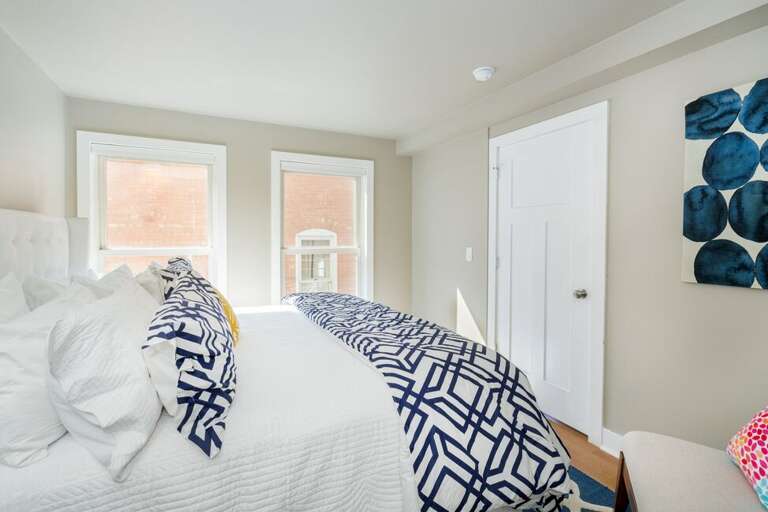 The king primary suite is decadently stylish and comfortable.