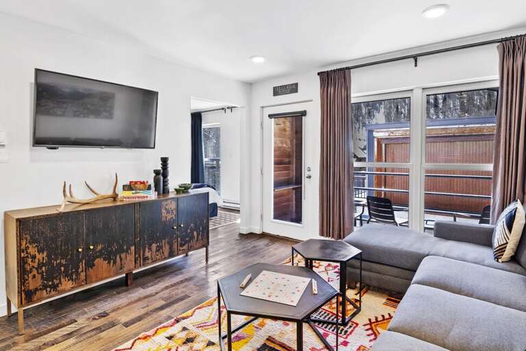 The living area allows Easy access to the deck and is located off the Primary Bedroom.