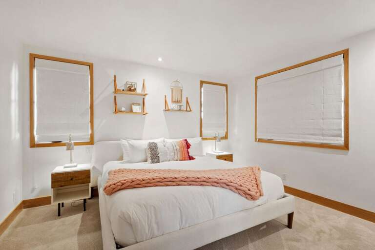 Entry-level Pink Guest Room features a king bed, private en suite, and a cozy, inviting atmosphere.
