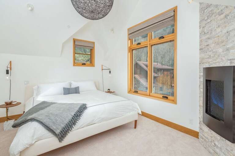 The king primary suite is situated on the top level, and has gorgeous views of the ski area.