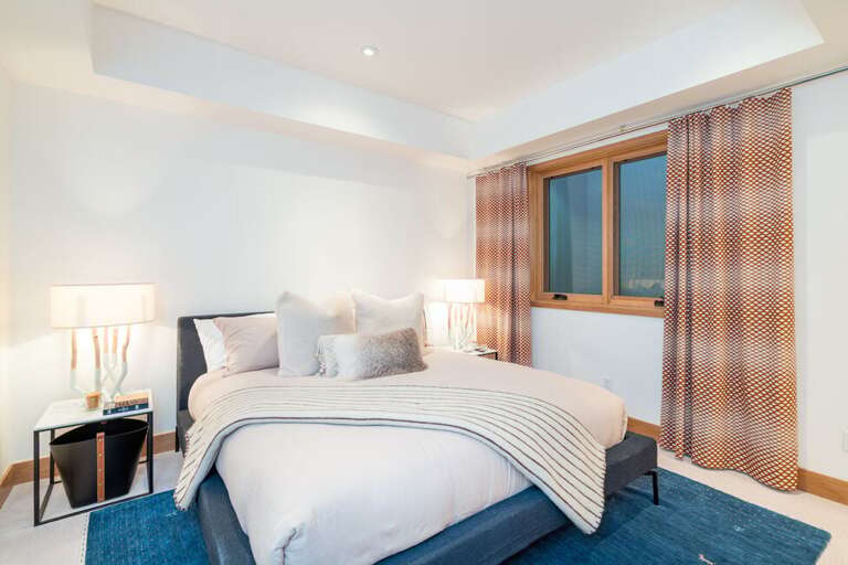 On the low-level of the residence is this deliciously neutral king guest suite with en suite.