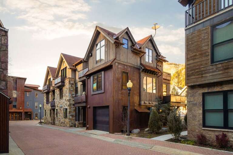 A luxurious four-bedroom, multi-level home in a quiet neighborhood featuring garage parking, private decks, hot tub, and stunning views.