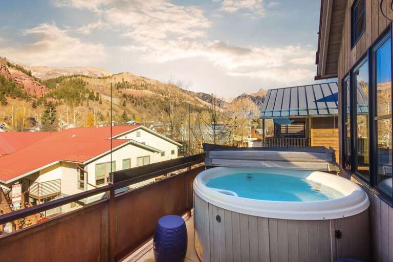 Private hot tub with stunning views, perfectly sized for four, conveniently located off the primary suite level.