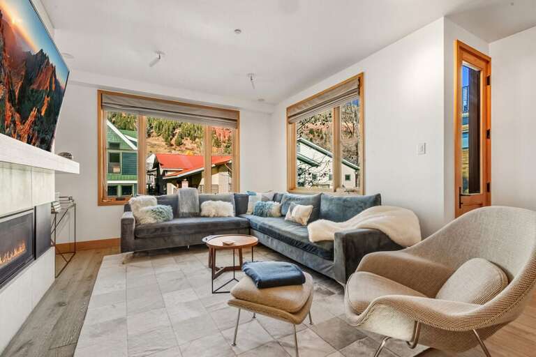 Relax in the cozy living area, perfect for family movie nights or a quiet evening after a day of fun.