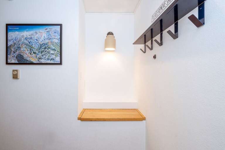 The downstairs entry to the condo features a boot drying rack & a bench seat for taking of ski boots!