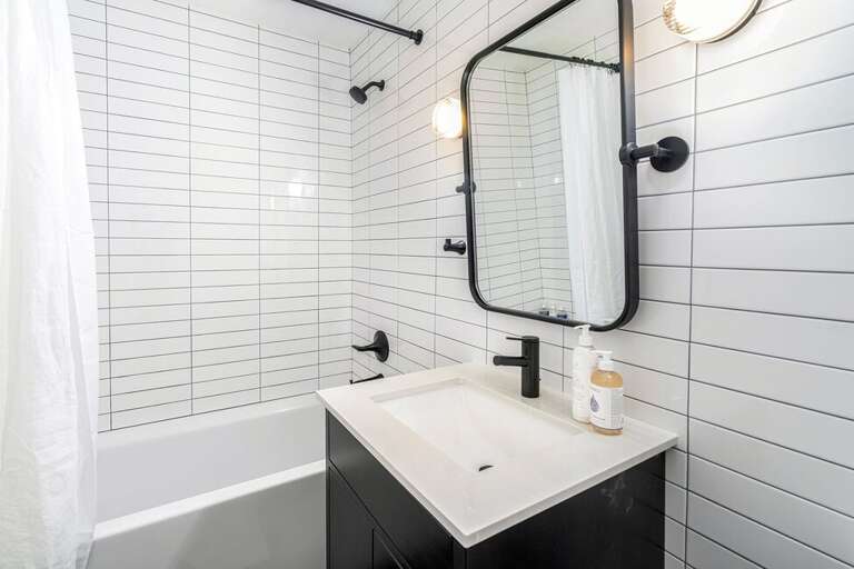 On the main living level there is a  newly remodeled full bathroom with a combined shower and tub.