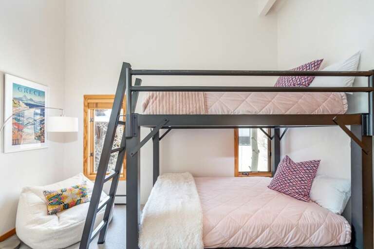 The bunk room features queen over queen bunk beds. The bunk room features queen over queen bunk beds.