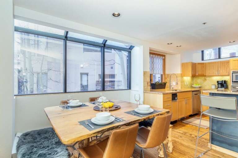Dining table seats 8 guests with 4 chairs and two large benches. Dining table seats 8 guests with 4 chairs and two large benches.