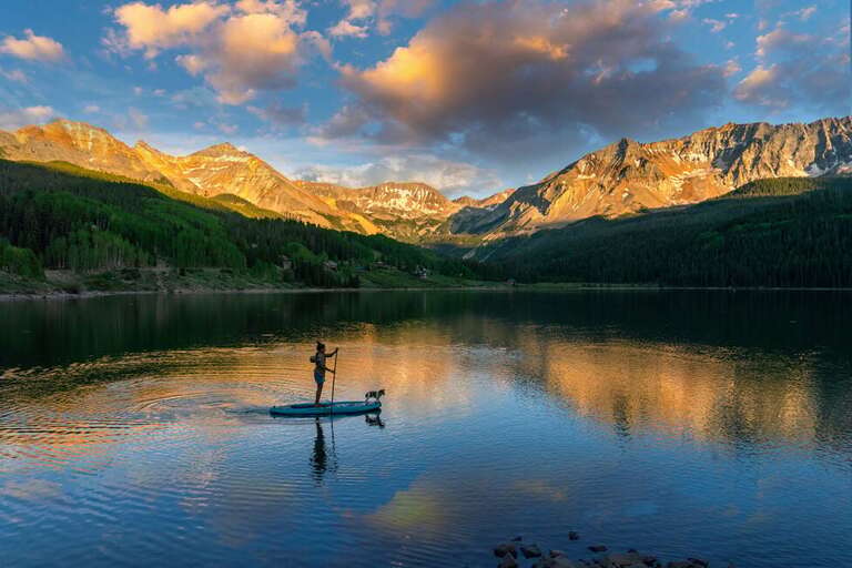 Enjoy an evening paddle board on one of the many alpine Lakes around Telluride.  Boards can be rented at many of the outdoor shops in Telluride or the Village. Enjoy an evening paddle board on one of the many alpine Lakes around Telluride.  Boards can be rented at many of the outdoor shops in Telluride or the Village.