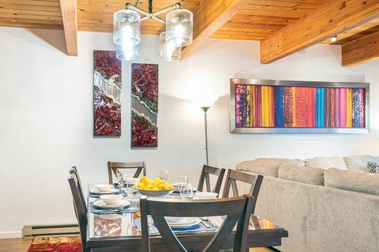 There is a dining room table for six and breakfast bar with seating for three. There is a dining room table for six and breakfast bar with seating for three.