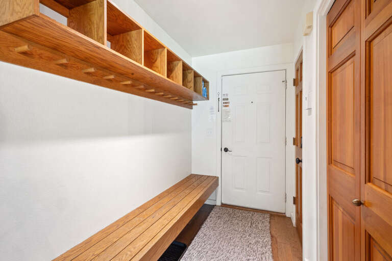 The entryway features a long bench and cubbies to keep your adventures organized!