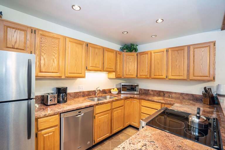 The kitchen is open plan with the living room and is well equipped for cooking family meals. The kitchen is open plan with the living room and is well equipped for cooking family meals.