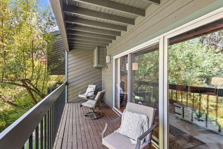 Peaceful private deck with swivel chairs.