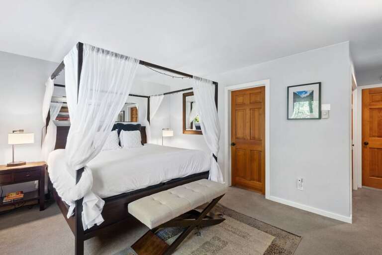 The Primary Bedroom is spacious area with a king bed and ensuite bathroom.