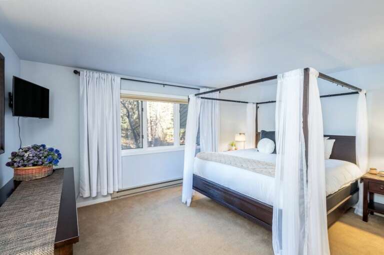 The Primary Bedroom is spacious area with a king bed and  ensuite bathroom.