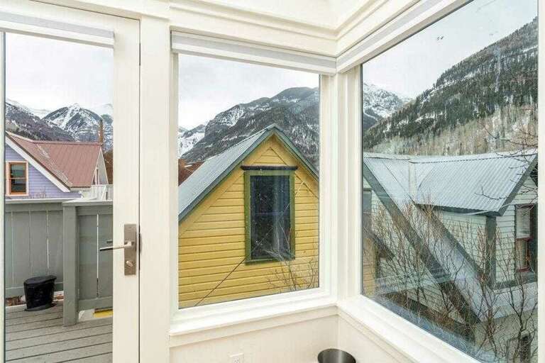 Ample windows provide lots of light to bedroom. Enjoy deck access from the bedroom level.