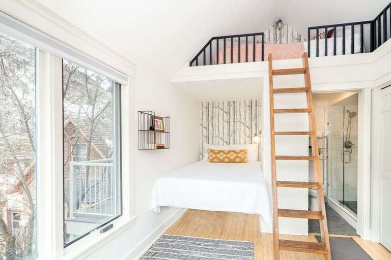 The bedroom features a queen bed with ensuite bathroom and a beautiful mountain view.