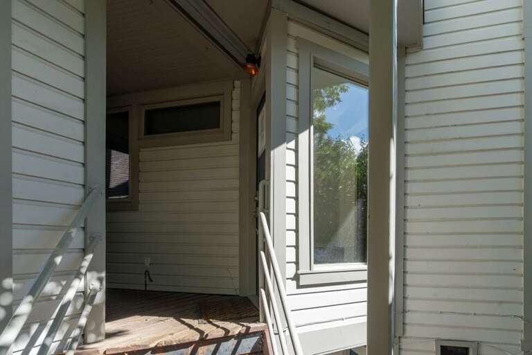 Semi-private entrance to the unit from parking area provides convenience.