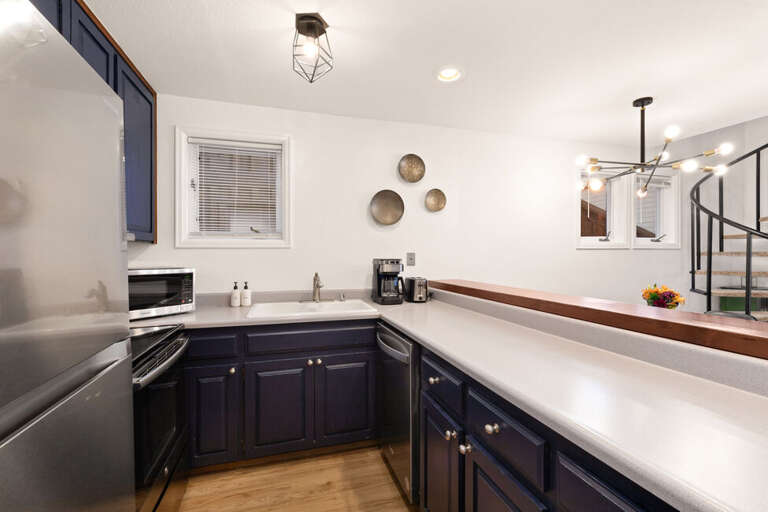 Open and spacious galley kitchen with ample counter space and modern amenities.