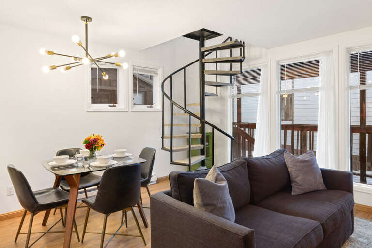Spacious family/dining area with natural lighting and open feel.