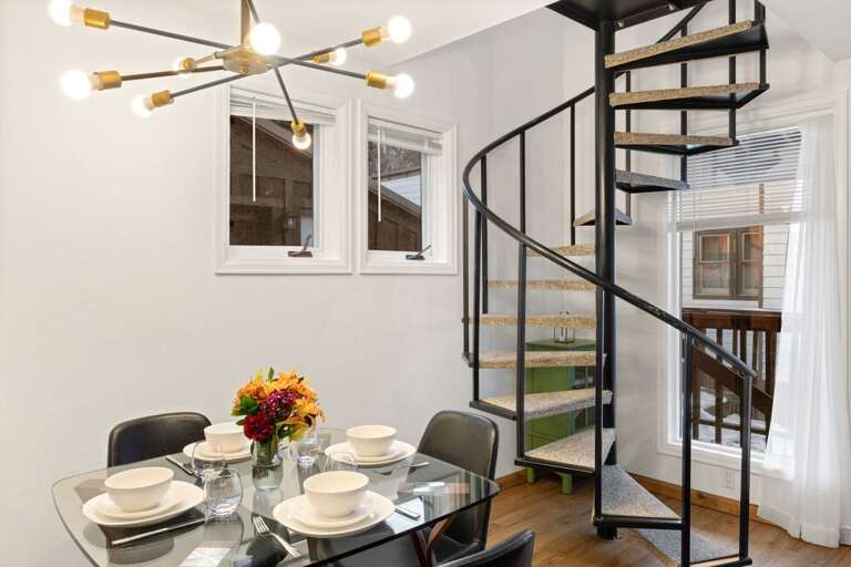 Spiral stairs leading to the second level with Primary room, loft room and full bathroom.