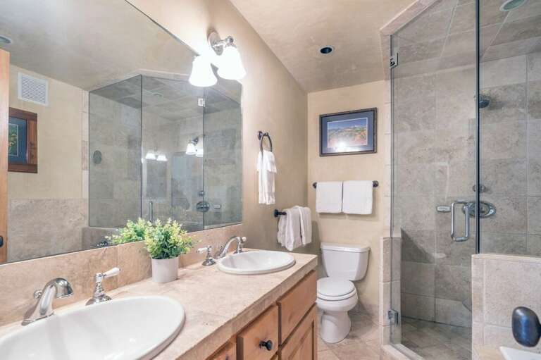 En suite Master bathroom has a large walk in shower and double vanity.