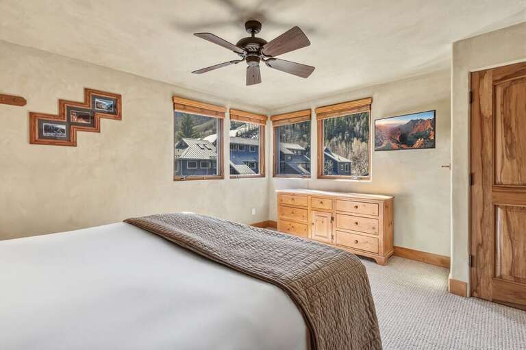 Enjoy panoramic mountain views from the primary suite, offering a serene start and end to your day in Telluride.