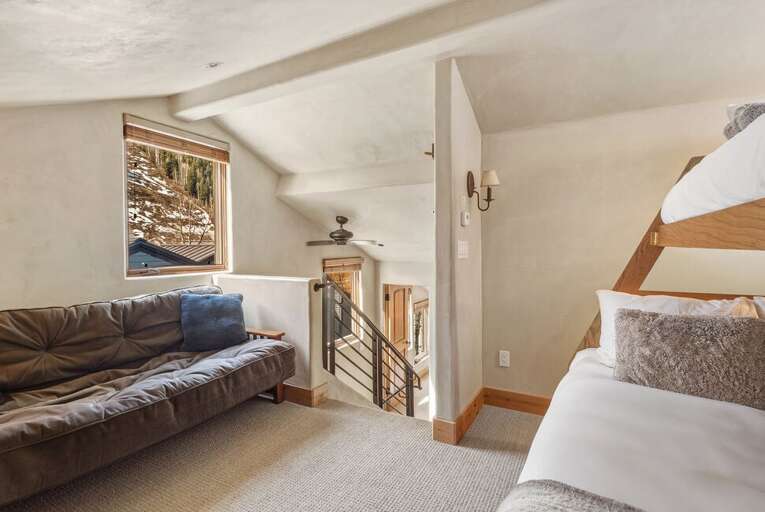 A fun and functional loft area with bunk beds and futon—ideal for extra guests or little ones.