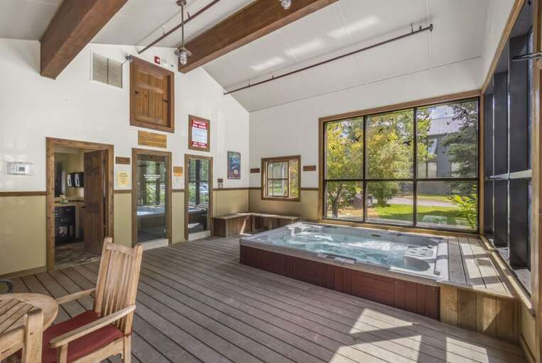 Indoor hot tub, steam room, shower, bathroom and changing room.