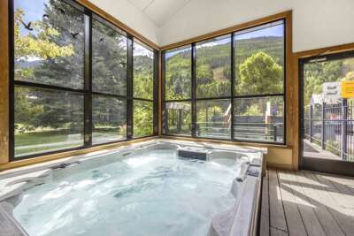Telluride Lodge offers indoor and outdoor spa area with hot tub, sauna room, shower and bathroom.