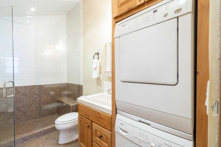 Shared bathroom includes washer/dryer convenience and large walk in shower.