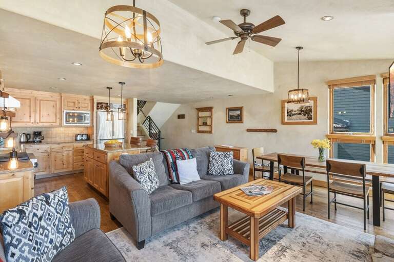 The spacious great room blends kitchen, dining, and living areas—perfect for entertaining or relaxing together.