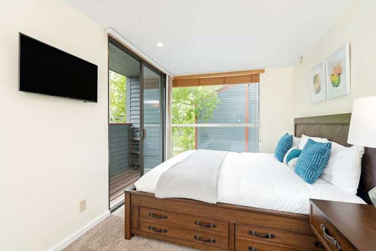 Up one level from the living area is another king bedroom with it's own private deck, flat screen TV and desk / work area.