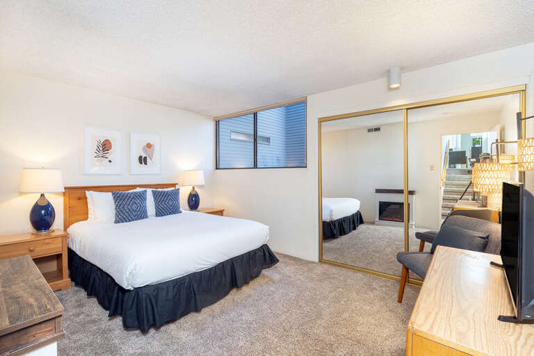 Down one level is a queen bedroom and adjacent bathroom. Brand new electric fireplace installed in 2023.