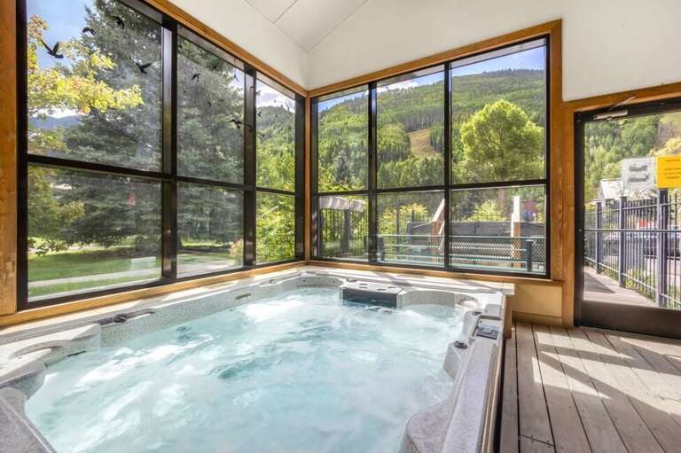 The Telluride Lodge Spa area features an indoor and outdoor 8 person hot tub for guests. This space also features a large steam room, shower and changing room as well as restroom. open 10am-10pm The Telluride Lodge Spa area features an indoor and outdoor 8 person hot tub for guests. This space also features a large steam room, shower and changing room as well as restroom. open 10am-10pm
