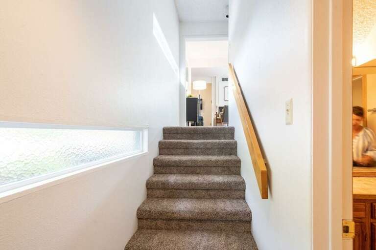 Stairs leading to lower level (or up to living area)