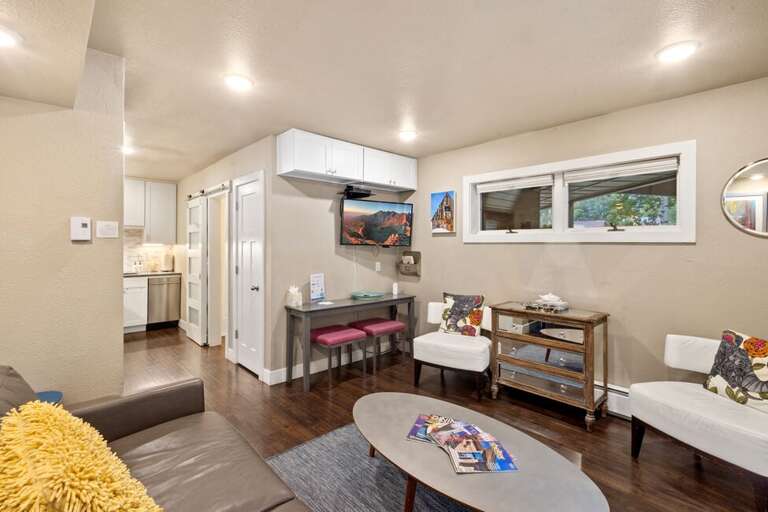 Comfortable living space with TV and sleeper sofa.