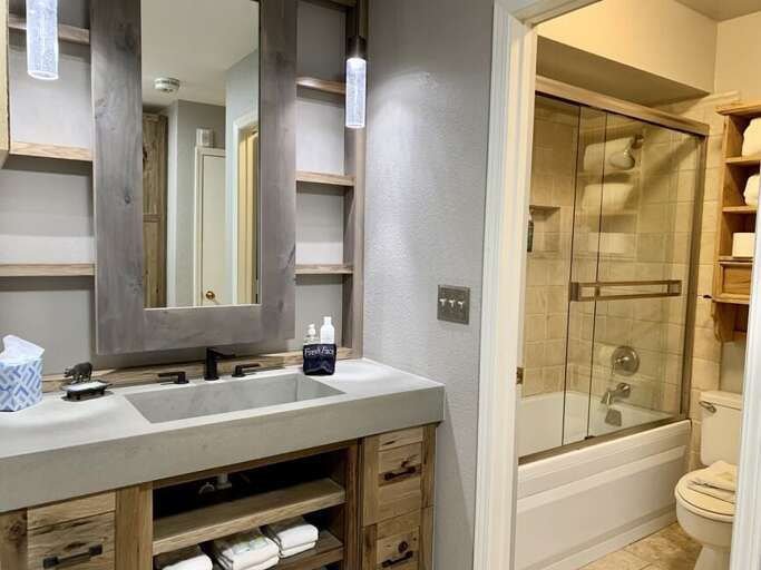 Elegant new finishes provide a mountain chic vibe in the new bathroom area.