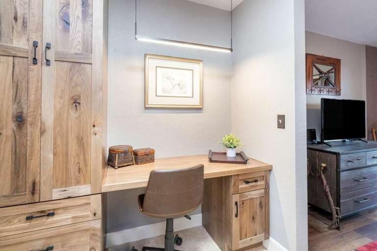 Plenty of storage to make yourself at home as well as an area to catch up on work if you must.