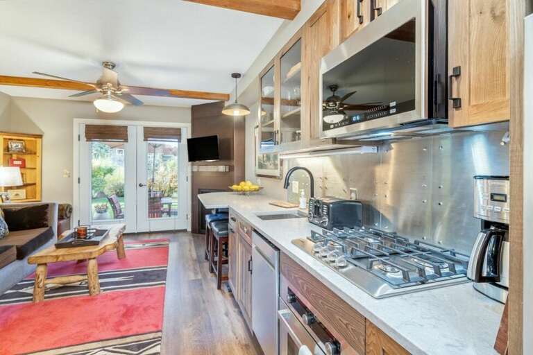 Viking Lodge 116 has a kitchenette featuring a microwave, oven, and refrigerator.